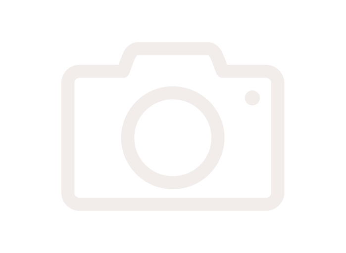 Faded outline of a camera icon on a white background.