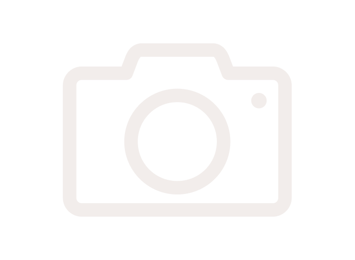 Faded outline of a camera icon on a white background.