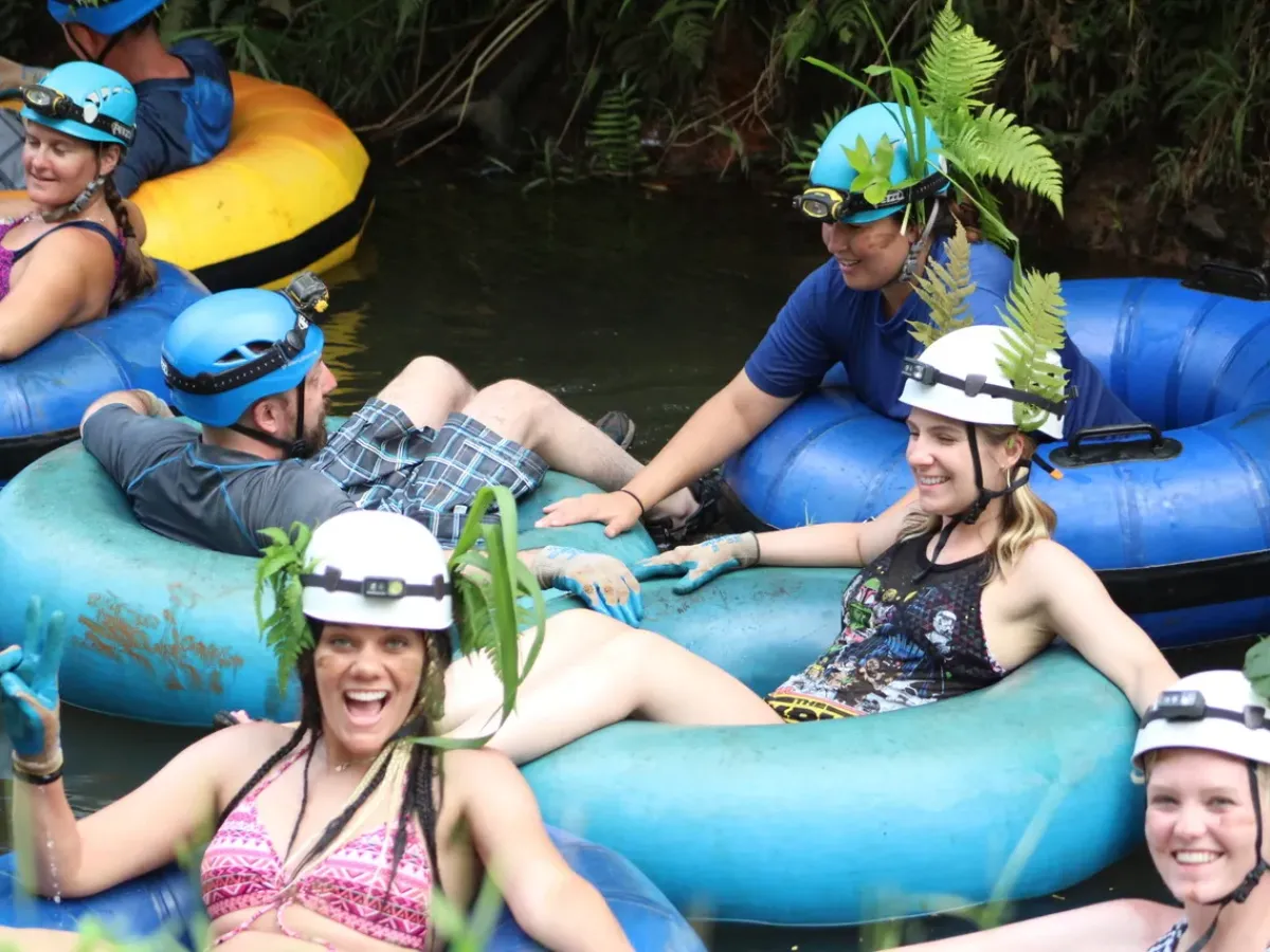 a group of people sitting on a raft