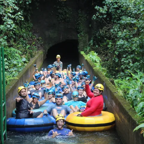 a group of people riding on the back of a boat