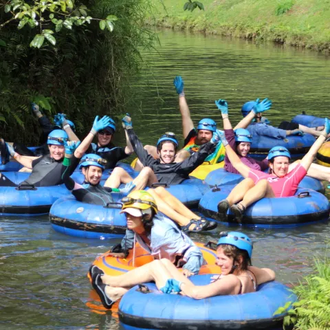a group of people riding on the back of a boat