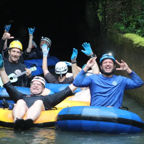 a group of people riding on the back of a boat