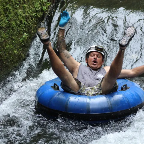 a person riding on a raft in a body of water