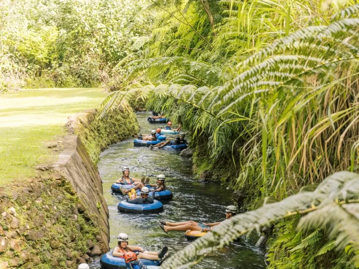 a group of people in a boat on a river