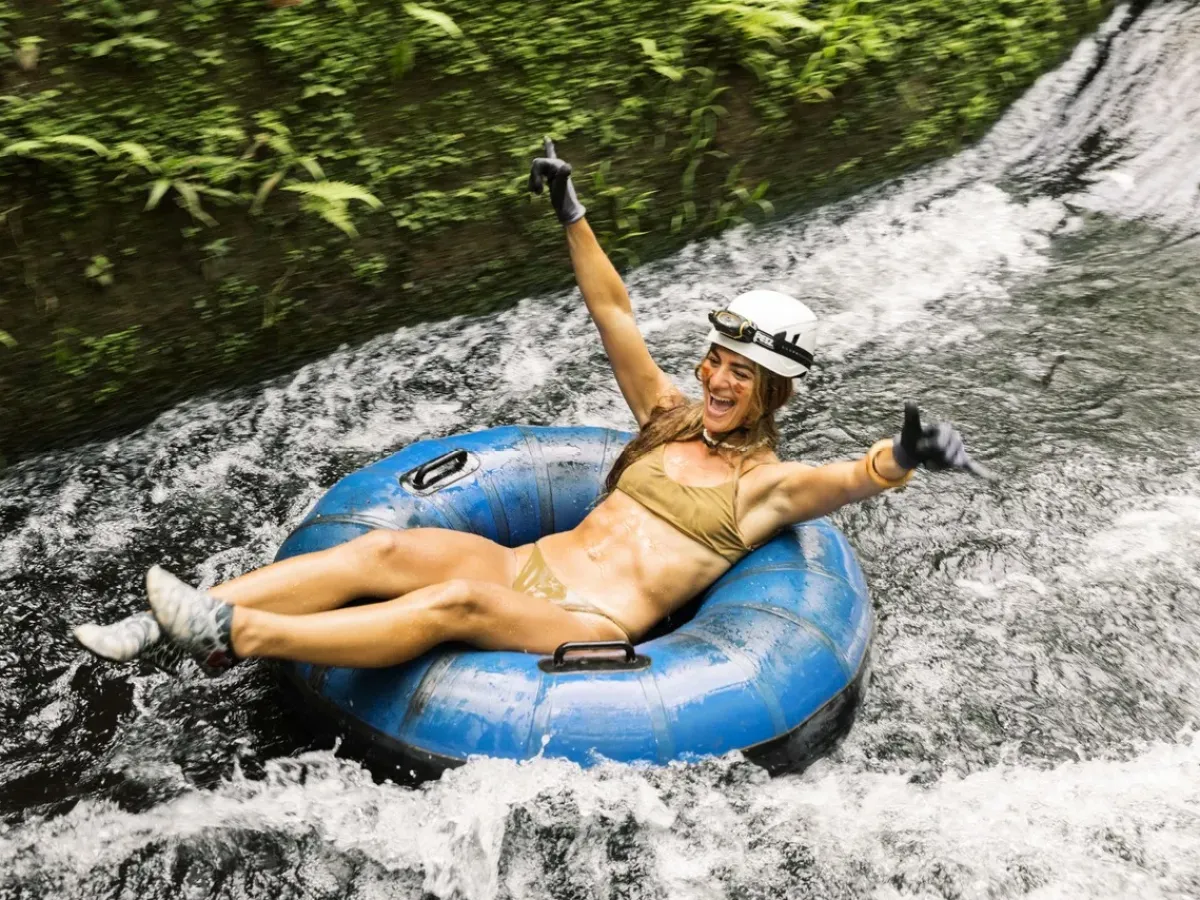 a person riding a surf board on a body of water
