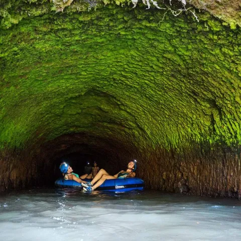 a group of people riding on the back of a boat on a river