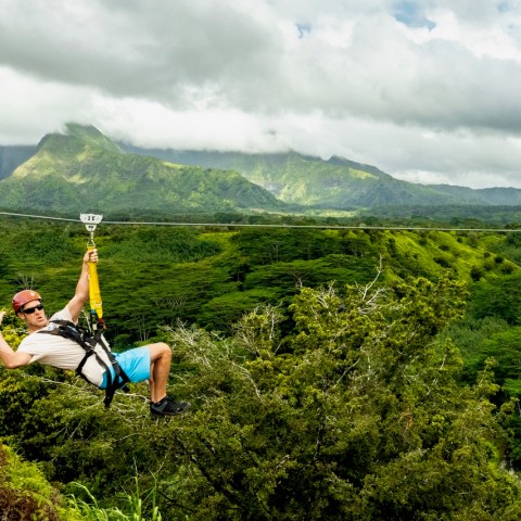 a person standing in front of a mountain