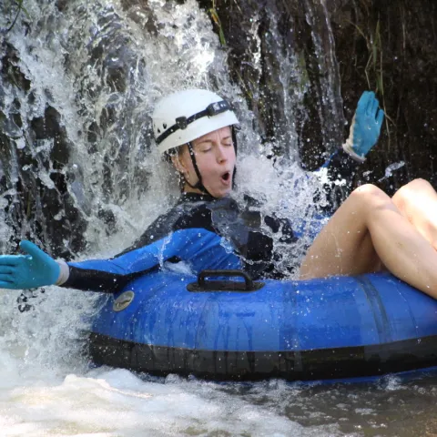 a person riding a snow board in the water