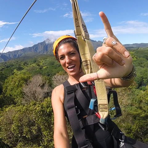 a person standing in front of a mountain