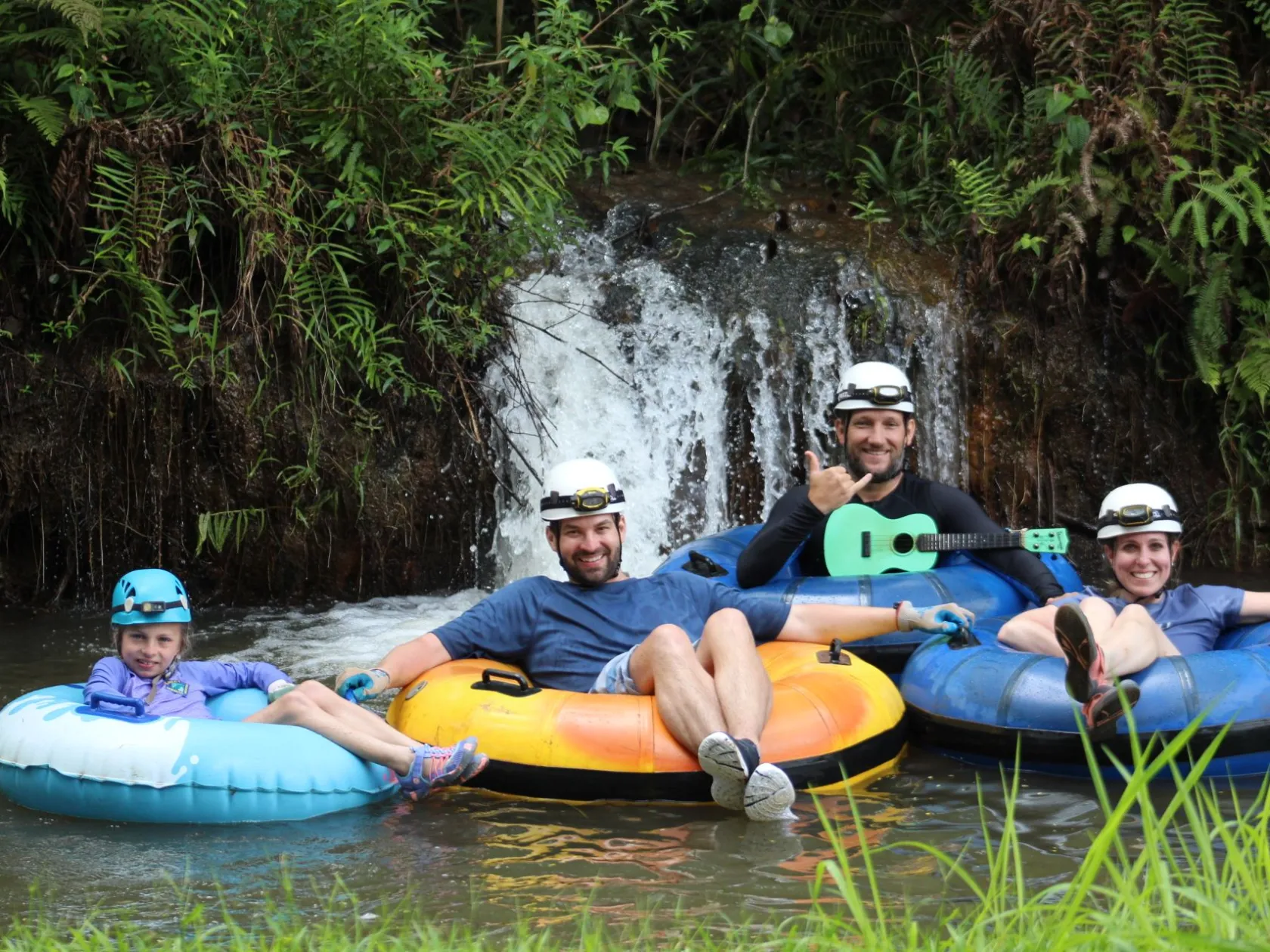 a group of people riding on the back of a boat