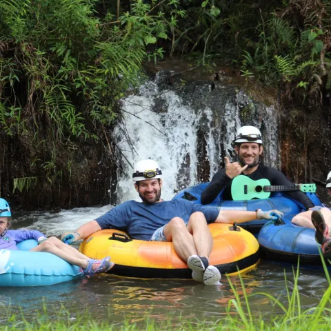 a group of people riding on the back of a boat