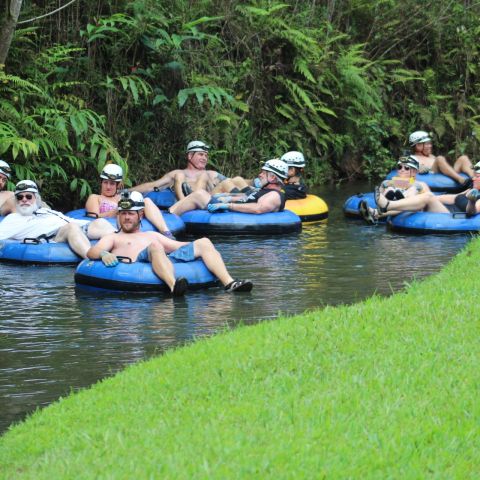 a group of people riding on the back of a boat