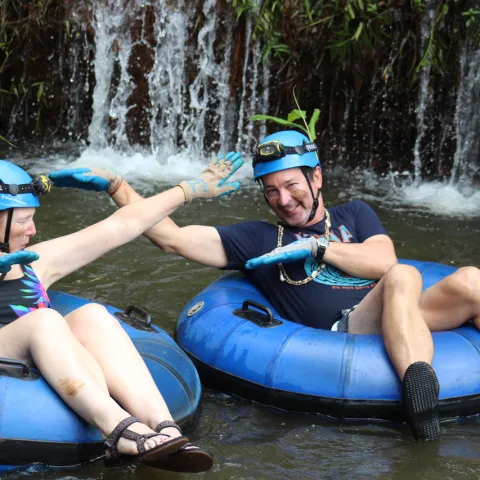 a group of people on a raft in a body of water