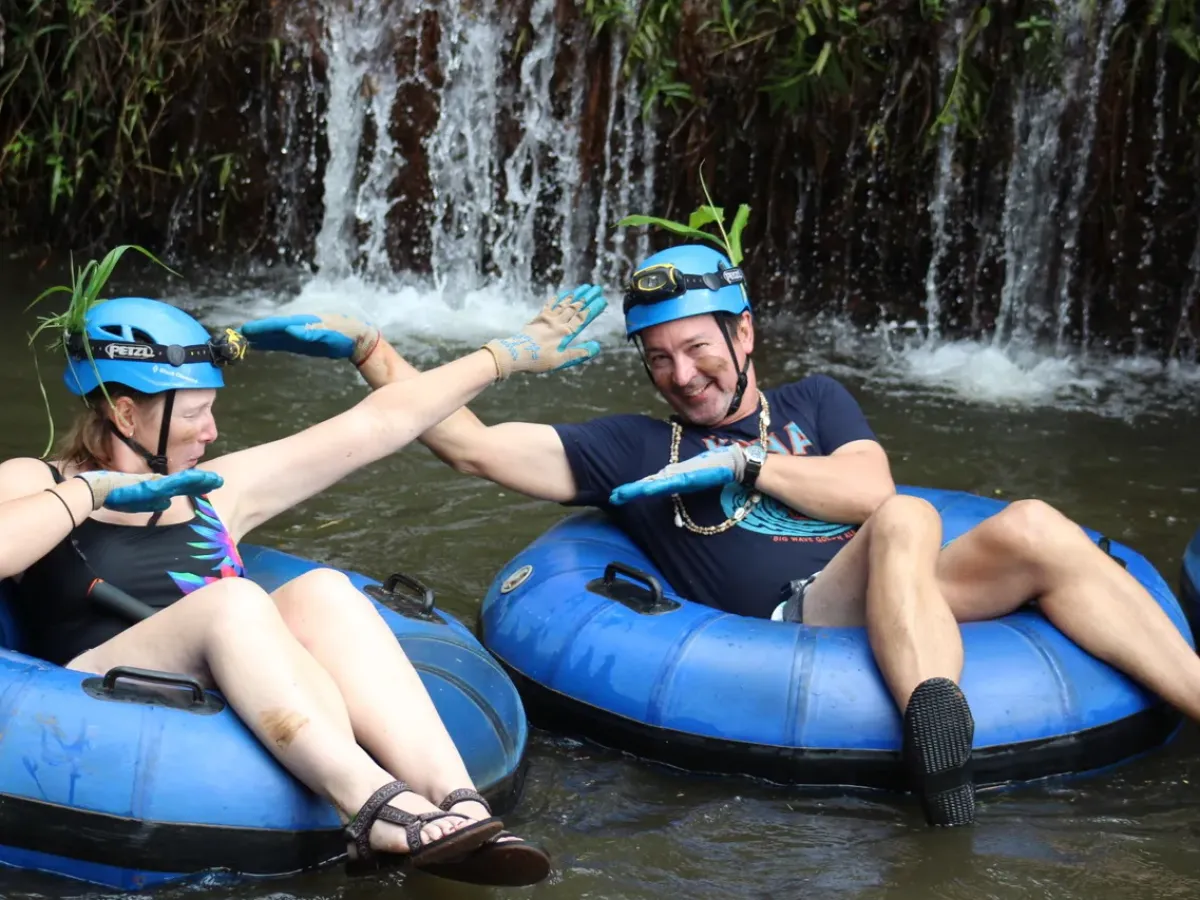 a group of people on a raft in a body of water