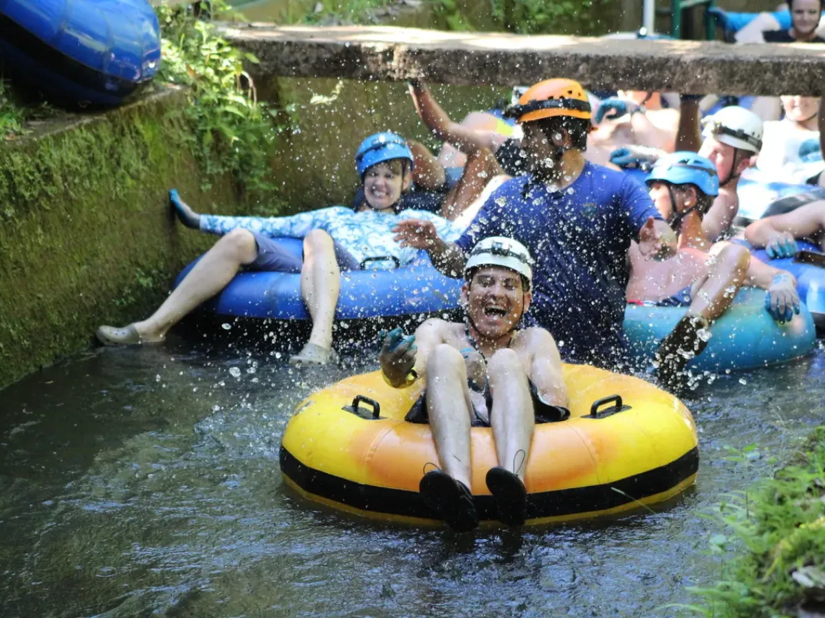 a group of people on a raft in a pool of water