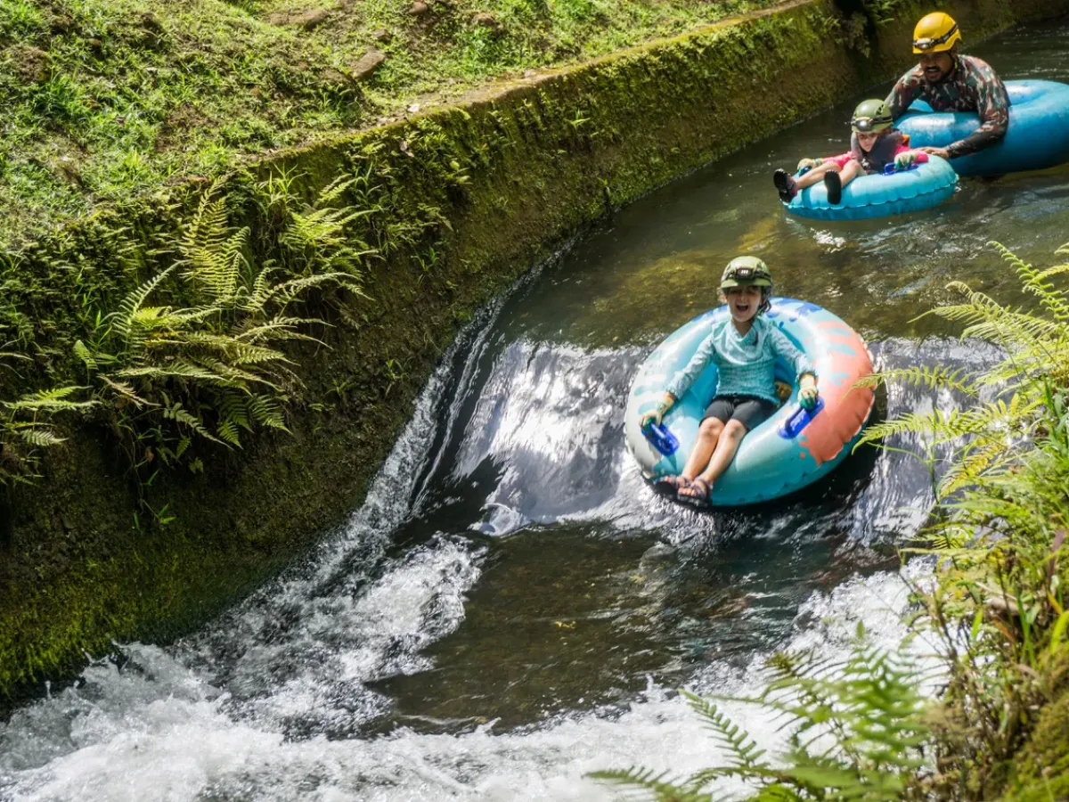 a man riding on a raft in a body of water