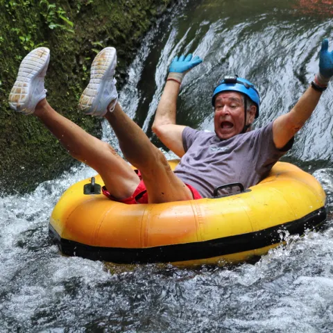 a person riding on a raft in a body of water