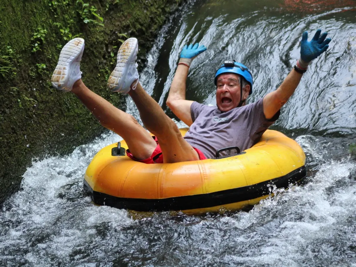 a person riding on a raft in a body of water