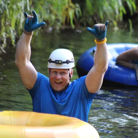 a person riding on the back of a boat