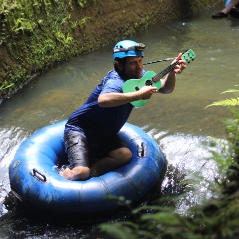 a person riding on a raft in a body of water