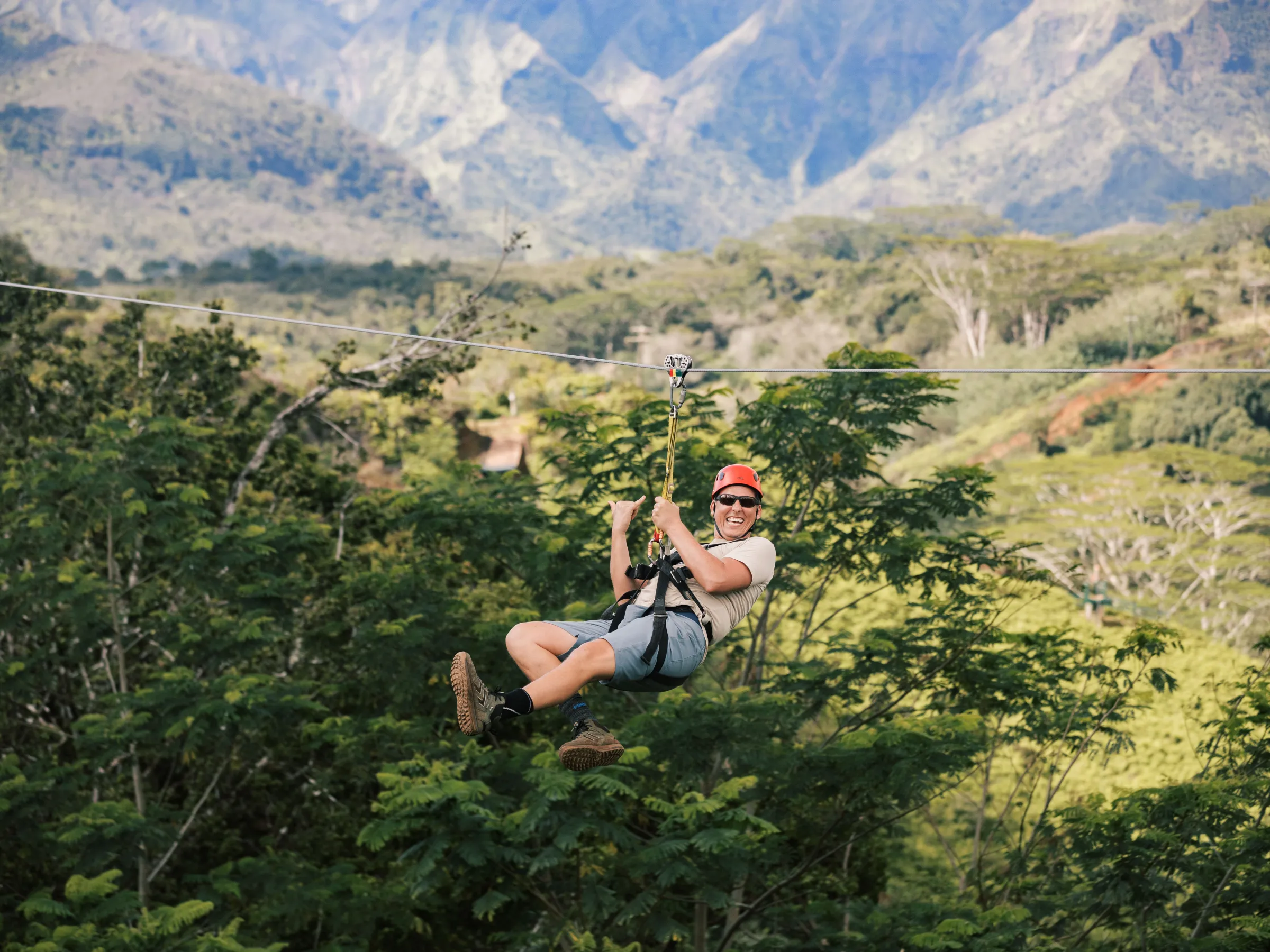 a man riding on top of a mountain