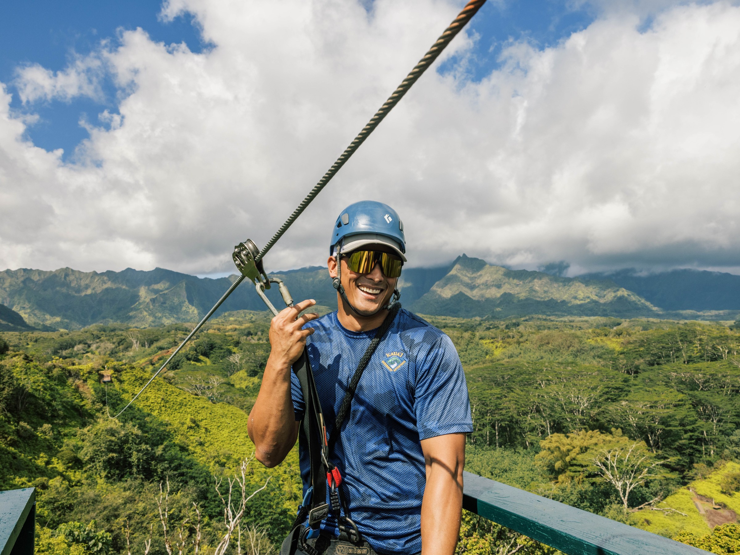 a man standing in front of a mountain
