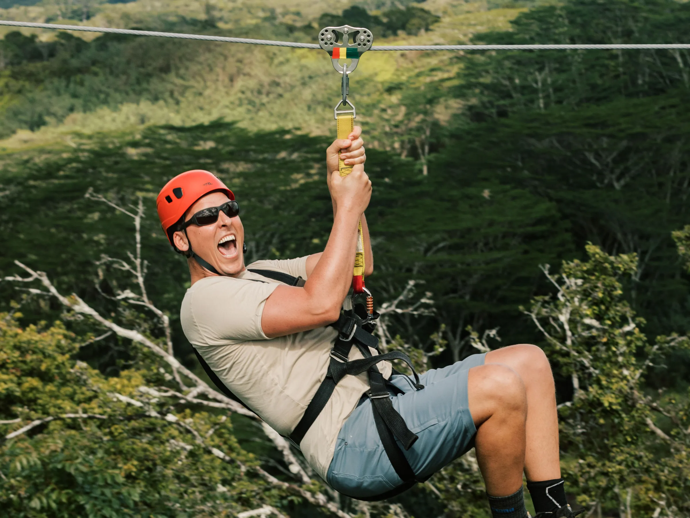 Trevor Bayne sitting on top of a mountain